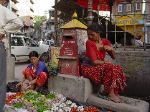 Two women who set up their vegetable shop in from of a letter-box on the street.  This was the norm for vegetable sales in kathmandu