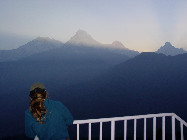 Quinn readies for a photo as the sun readies to rise.  That is Annapurna Machhapuchhre and others in the photo