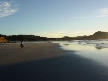 Mother strolls the pristine beach